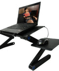 Premium Aluminum Laptop Bed Tray With Adjustable Angled Legs And Cooling Radiating Vents Built Tough Hassle Free Portable Folding Workstation Desk for use on a couch.