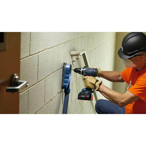 Professional 18V Brushless Hammer Drill Driver Kit With 8 Ah Battery Pack And 1330 Inch Pound Torque used by worker drilling into wall.