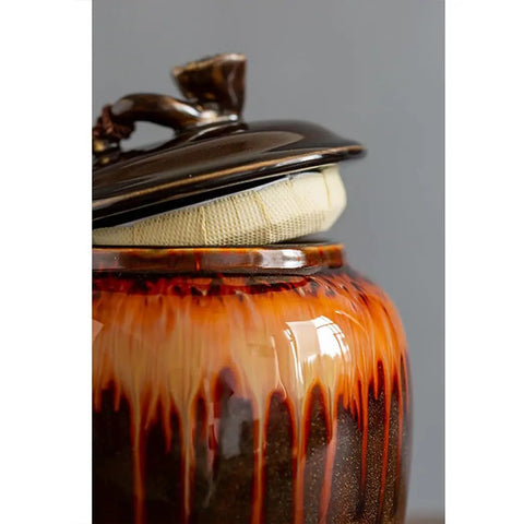 Solid Glazed Ceramic Tea Canister With Airtight Ruyi Lid featuring a unique drip glaze design, ideal for storing coffee or spices.