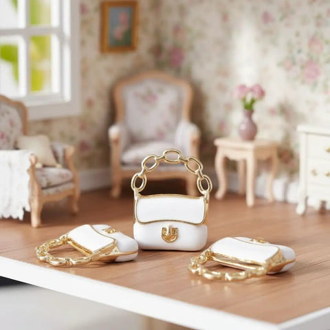 Three Pack Mini Handbag Set For Dollhouse Decor And DIY Jewelry Charms on display in a miniature living room scene, white with gold accents.
