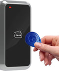 Hand holding blue EM card near Wiegand Card Reader 125KHz RFID With 26 Bit Or 34 Bit Output Durable Metal Enclosure for access control