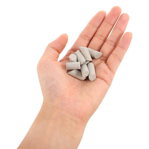 Hand holding Cylinder Shaped Silicon Carbide Tumbling Media 440g Pro Grade Deburring And Self Loss Prevention For Industrial Finishing, Heavy Duty Vibratory Bowl Polisher For Ceramic Workpieces.