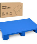 Beefy Heavy-Duty Plastic Pallet for Basement and Garage Storage HDPE Stackable Floor Pad With 2000 Lbs Capacity next to box