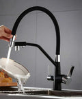 GAZOGJ 3-Way Kitchen Faucet with 360°Rotatable Shower Head, black finish, water flowing from sprayer, modern kitchen design.