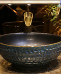 USZWBY Vessel Sinks Bathroom Vessel Sink Round Ceramic Washbasin with a textured dark blue finish, ideal for elegant bathrooms.