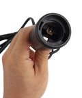 Hand holding a black E26 E27 socket from the Straight Plug And Play Pendant Light Kit With 9.8 Ft Cord And On Off Switch Retro Industrial Hanging Lamp For Living Room Bedroom White E26 E27 Socket No Fuss Setup Super Chill Vibes 2 Pack.