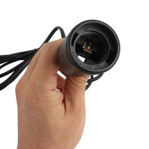 Hand holding a black E26 E27 socket from the Straight Plug And Play Pendant Light Kit With 9.8 Ft Cord And On Off Switch Retro Industrial Hanging Lamp For Living Room Bedroom White E26 E27 Socket No Fuss Setup Super Chill Vibes 2 Pack.