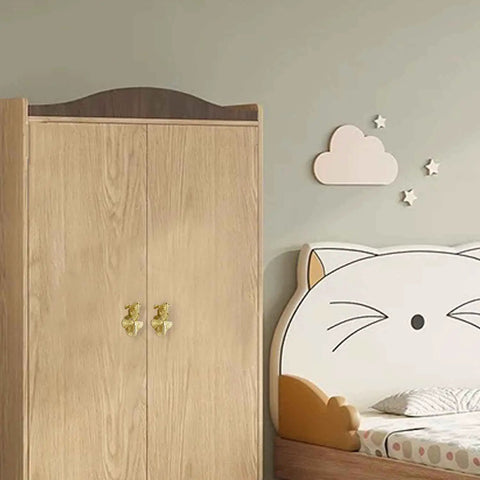 Solid Brass Goldfish Drawer Knobs Set For Cabinets And Dressers on wooden wardrobe in child's room, easy install, durable finish.