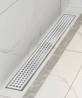 32 Inch Linear Shower Drain With Removable Grate Cover AISI 304 Stainless Steel Floor Drain installed in a tiled shower floor.