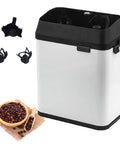 No Sweat Electric Portafilter Coffee Cleaner With Built In Knock Box in black and silver with coffee beans beside it.