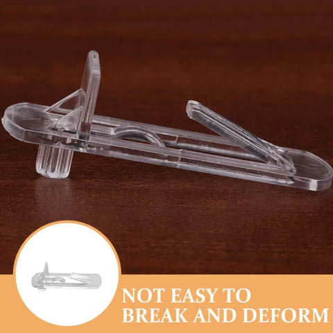 Close-up of 30 Pack Plastic Shelf Pegs and Clips for Cabinets Deformation Resistant and Easy Install No Tools Needed Built to Stop Shelf Shake Fit 15mm 16mm Boards Great for Kitchen and Home on wooden background, showing transparent design.