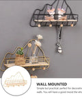 Golden Wall Mount Storage Rack With Heavy Duty Iron And Wood, Slick Hook Organizer For Kitchen Bedroom, Straight Up Keeps Your Space Tight, Zero Clutter Daily Essentials Shelf Holder with decorative items.
