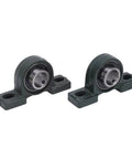Close-up of two metal bearing housings from the 24 Inch Rear Axle Kit With 160mm Brake Disc For Go Karts And ATVs, side view.