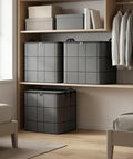 Heavy Duty Nonwoven Storage Bins Three Pack With Sturdy Handles Hella Spacious Fit For King Size Quilts stacked on a shelf.