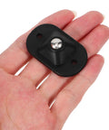 4pcs Small Furniture Adhesive Swivel Caster Wheels held in hand, showcasing black material and ball bearing design for easy installation.