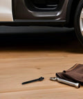 Pro Grade Crankshaft Pulley Install Tool And Harmonic Balancer Puller Kit For Engine Repair on garage floor next to car