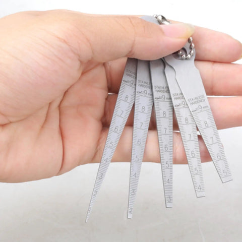 Close-up of 5 Piece Pro Grade Steel Feeler Gauges Set With 0.1mm Resolution For Tight Space Measurement Up To 10mm In Welding and Mechanical Inspection
