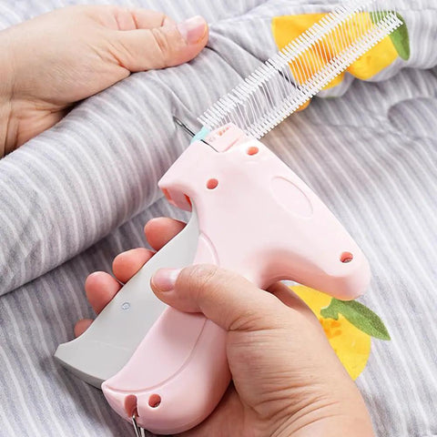 No Sweat Heavy Duty Handheld Sewing Gun Quick Clothing Repair Tool Featuring Pink Grip in use on fabric.