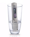 Digital TDS Water Quality Tester with Temperature Reading and Three Button Controls in a glass of water