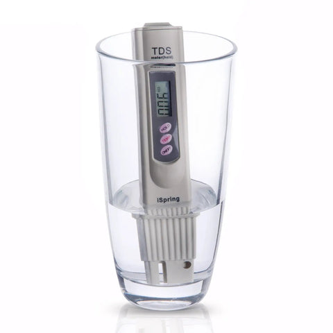 Digital TDS Water Quality Tester with Temperature Reading and Three Button Controls in a glass of water