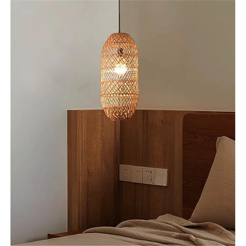 LQZCXMF Living Room Rattan Pendant Light 22.8" H Large Wicker Lamp Shade above a wooden headboard in warm bedroom setting.