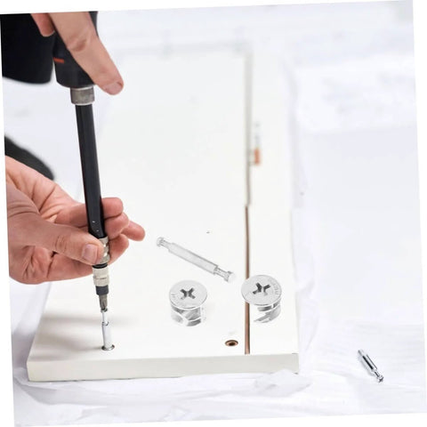 Installation of 20 Sets Furniture Connecting Cam Fittings Kit Connectors Dowels For Cabinets with screwdriver on white panel