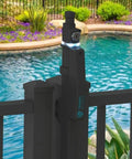 Rock Solid 20 Inch Magnetic Pool Latch With Dual Alarms And Beacon Lights To Lock Down Your Swim Area Auto Clicks When Gate Swings Wide Open Upgraded Knobs Make It A Cinch For Parents While Shutting Out Tiny Toddlers Near Pools on a black fence overlooking a swimming pool.