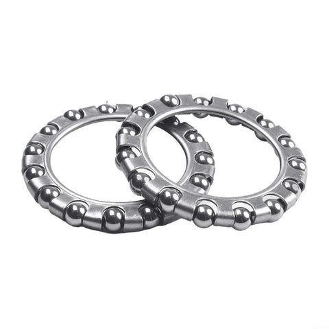 Two visible pieces from a Steering Headset Ball Bearings Set Of 4 For Electric Bikes, Durable Steel Construction, 1.57 Inch Inner By 1.06 Inch Outer Diameter.