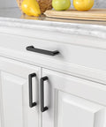 10 Pack Matte Black 5 Inch Hole Center Kitchen Cabinet Pulls ZH0005MB Modern Hardware installed on white drawer and cabinet