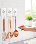 No Drill Wall Hooks 10 Pack For Kitchen Bathroom And Home With Heavy Duty Adhesive Hangers No Tools Needed Damage Free Removal Removable Non Marking Tape Tool Free Install Strong Hold For Pictures Towels Keys And More wall hooks holding kitchen utensils on tile