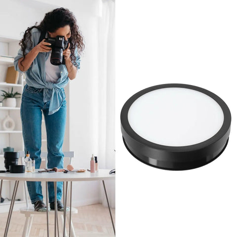 Stunning 360 Degree Rotating Display Stand With Electric Turntable, Adjustable Speed And Direction Control Via Remote, USB Powered 22cm Platform Featuring Colorful LED Lights For Pro Product Photography And Live Streaming, shown in use with photographer.