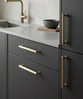 Six Pack Champagne Bronze Cabinet Pulls With Ribbed Knurl Texture And AntiFingerprint Finish Solid Zinc Alloy Kitchen Hardware installed on dark cabinets.