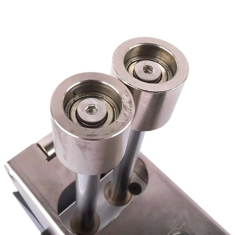 Close-up of durable metal rollers on a Three Station Edge Roller Bender for metal bending, adjustable from zero to ninety degrees.