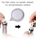 Hands inserting 200 Pcs Microdermabrasion Cotton Filters Replacement 10 mm Universal Fit into diamond dermabrasion machine