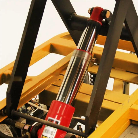 Close-up view of hydraulic cylinder on Heavy Duty Hydraulic Lift Table And Four Wheel Manual Push Platform for pallet handling.