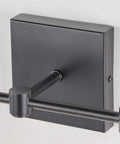 Close-up of matte black backplate and arm of Three Light Black Vanity Light Fixture Over Mirror With Clear Glass Shades