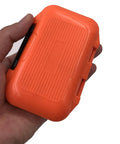 Hand holding small orange box from Heavy Duty Fishing Lure Box For Tackle Storage With Waterproof Compartments Durable Spoons Hooks Baits Organizer