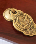 Chinese Style Vintage Brass Drawer Pulls Set Of 2 With Antique Bronze Finish on wooden surface, ornate dragon design