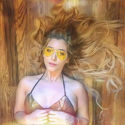 Top Shelf Anti Glare Night Vision Polarized Aviator Sunglasses Decked Out In Sleek Gold Frames And Bright Yellow Lenses Made For Easy Night Cruising And Cutting Through Blinding Headlight Flares Up That Truly Rock worn by model with long blonde hair and sequined outfit.