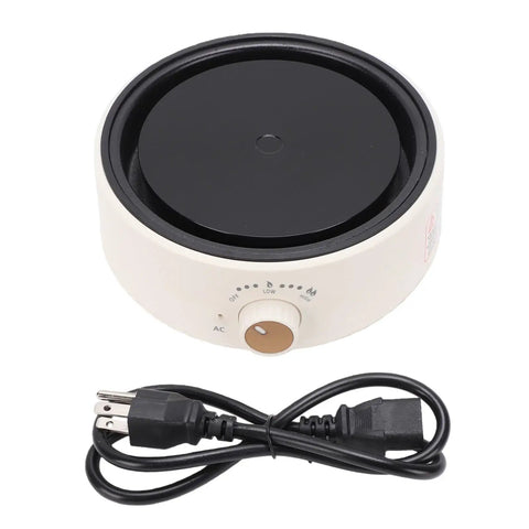 Compact Digital Induction Hot Plate For Boiling Water And Warming Tea with black cooking surface and control dial.