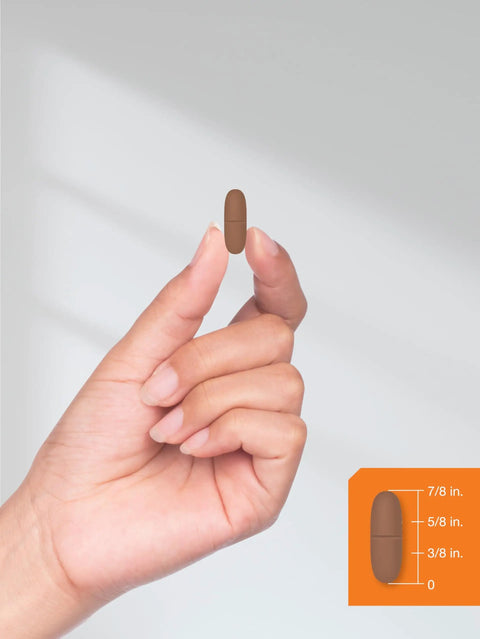 Hand holding Calcium 600 Mg With Vitamin D3 Coated Caplets for Women and Men, Vegetarian, Non GMO Gluten Free Supplement, 500 Caplets