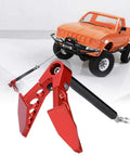 Metal Foldable Earth Anchor Winch For 1/10 RC Crawlers next to orange RC truck, red durable mini winch anchor for Axial SCX10