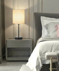 Two Pack Table Lamps With USB Ports And AC Outlet, white fabric shade nightstand lamp in modern bedroom setting, charging capability visible