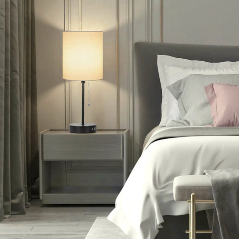 Two Pack Table Lamps With USB Ports And AC Outlet, white fabric shade nightstand lamp in modern bedroom setting, charging capability visible