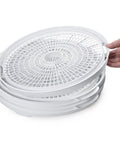 Stackable trays of Electric Food Dehydrator With Four Stackable Trays And Top Mounted Fan for healthy snacking.