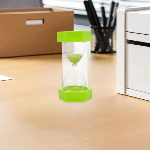 2 Minute Mini Hexagon Sand Timer In Grass Green on office desk, quick visual reminder for toothbrushing, studying, cooking, and meetings.