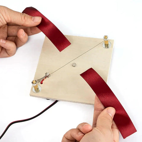 Hot Ribbon Cutter For Ribbons And Webbing, Electric Rope Cutter Machine 5V 2A demonstrated cutting red ribbon on wire