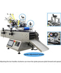 Workhorse Automatic Labeling Machine With Grippy Roller Conveyor, features adjustment handles and touchscreen for bottle wrapping.