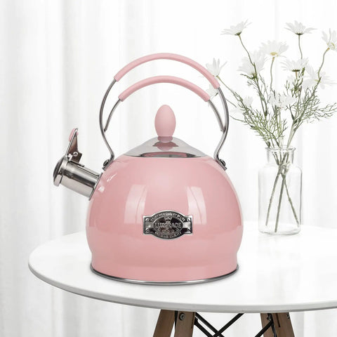 Stainless Steel Whistling Tea Kettle for Stovetop and Induction, 2.6 Quart Teakettle, pink finish on a white table with flowers.