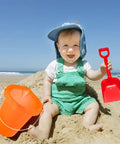 Child playing with Six Piece Beach Buckets and Shovels Set for Kids, 7.6 Inch Pails and Shovels, water buckets in sand